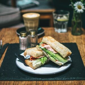 ham sandwich on white ceramic plate