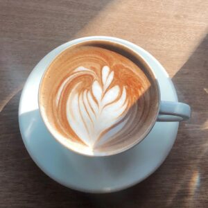 white ceramic cup with brown and white liquid