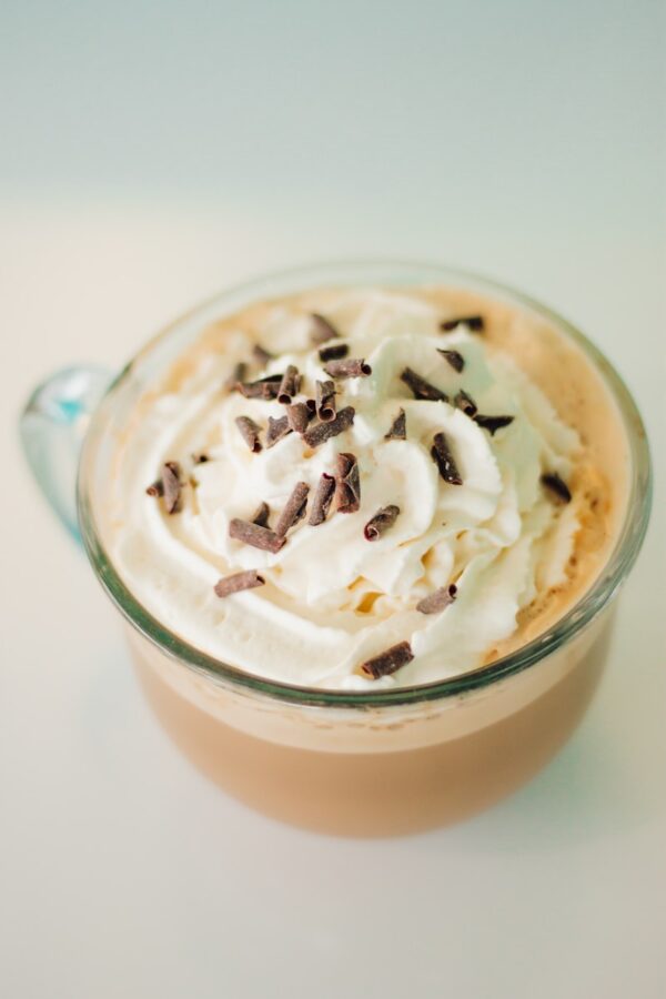 ice cream with white cream on clear glass cup