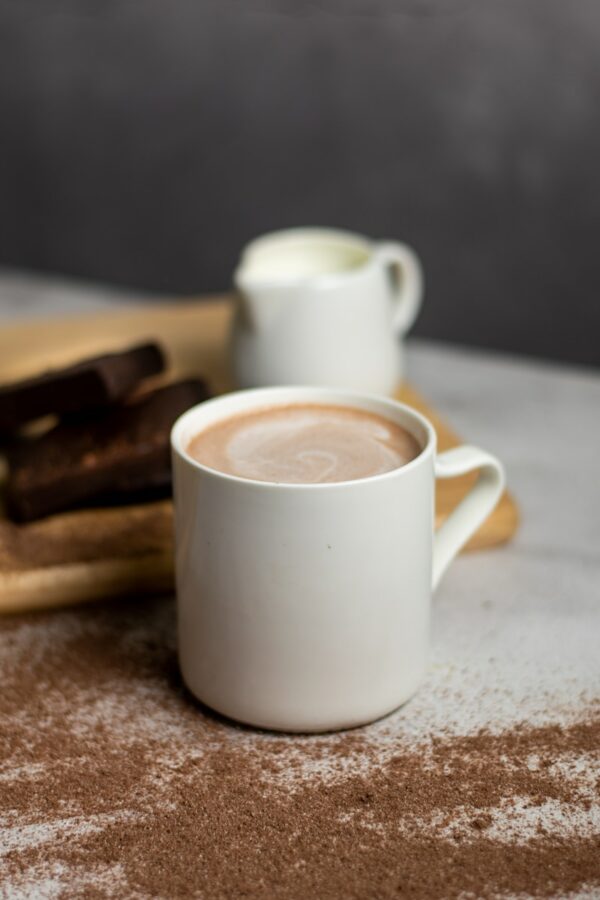 white ceramic mug with coffee